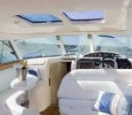 Bright interior of an Inception sports cruiser with elegant seating and controls.