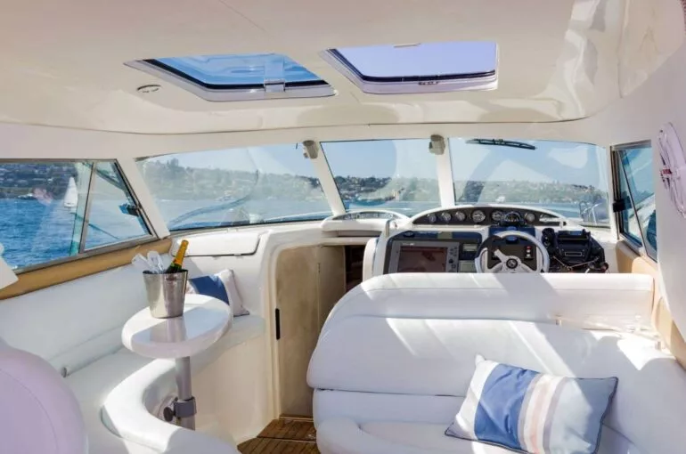 Bright interior of an Inception sports cruiser with elegant seating and controls.