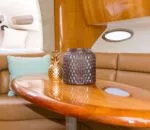 Stylish interior of an Inception sports cruiser featuring a wooden table and decor.