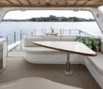 Spacious interior of the Enigma boat in Sydney with seating area.