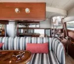 Elegant interior of the Enigma boat in Sydney with striped seating.