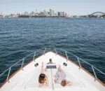 Relaxing on the bow of an enigma boat in Sydney Harbour.