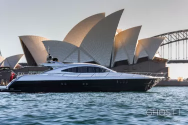 G1 main image Luxury boat near iconic Sydney Opera House at sunset.