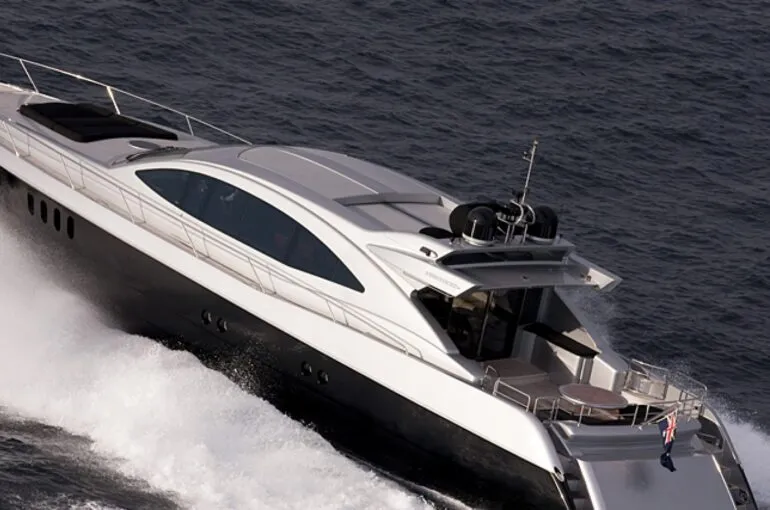 Sleek luxury yacht cruising over the ocean waves for ghost 1 boat hire.