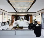 Luxurious interior of the Ghost II Superyacht with elegant furnishings. Spacious and stylish lounge area aboard the Ghost II Superyacht featuring modern decor.