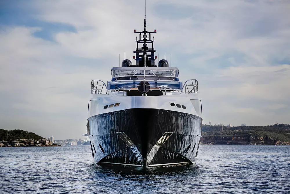Ghost II Superyacht anchored in calm waters with a scenic backdrop.