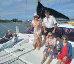 Group of people enjoying a sunny day on the Spellbound boat.