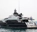 Ghost II Superyacht anchored in calm waters with a sleek design.