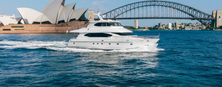 Luxury salt boat cruising near Sydney's iconic Opera House and Harbour Bridge.