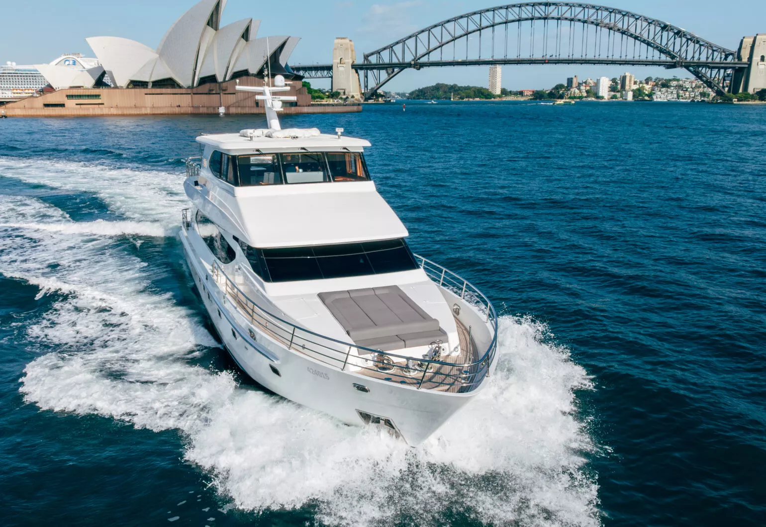 Luxury salt boat cruising in Sydney Harbour with iconic landmarks.