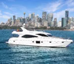 Luxury yacht cruising in front of a city skyline and water. Elegant boat sailing near urban skyline and waterway.