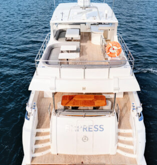 Luxurious Empress Motoryacht with spacious deck and seating area. Stylish Empress Motoryacht featuring a comfortable outdoor lounge space.