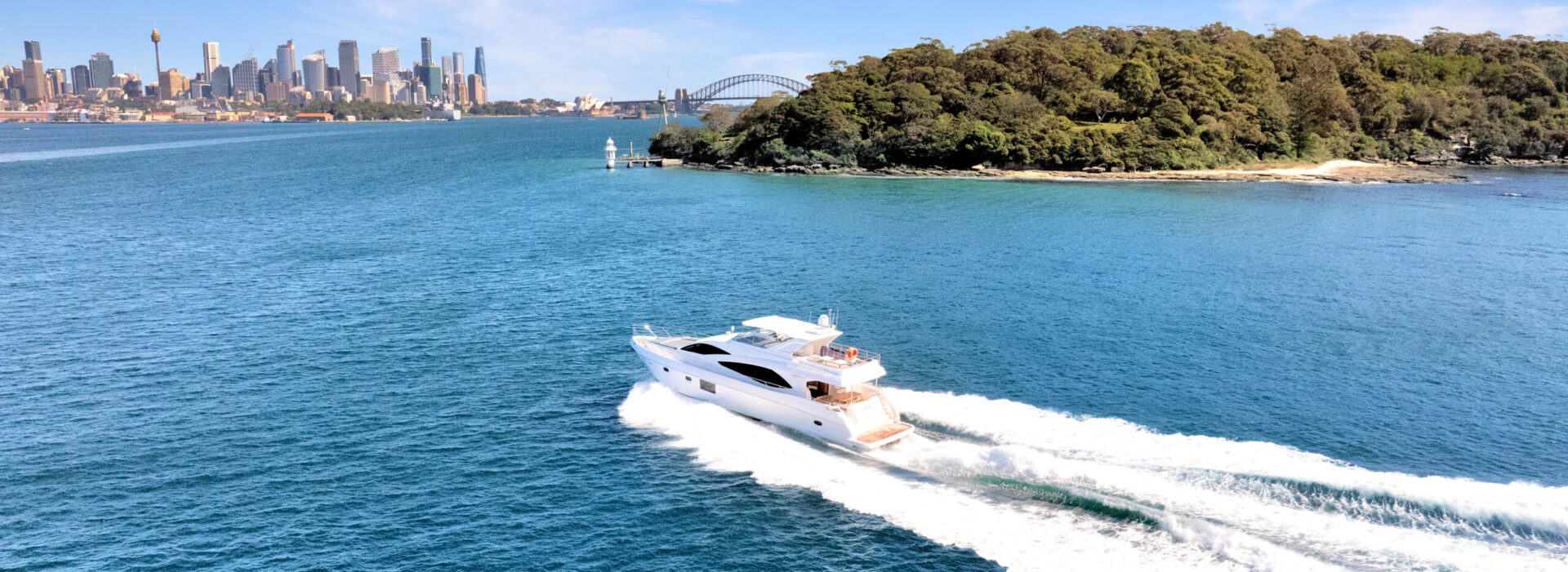 Empress 77ft motoryacht cruising across open water by Dreamboats