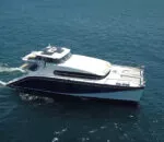 Sleek Passion Catamaran gliding smoothly over clear blue waters.