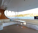 Spacious interior lounge area on a Passion Catamaran with scenic views. Variation #1: Elegant seating arrangement inside a Passion Catamaran with water views.