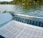 Relaxing on a catamaran deck with serene water views in Sydney.