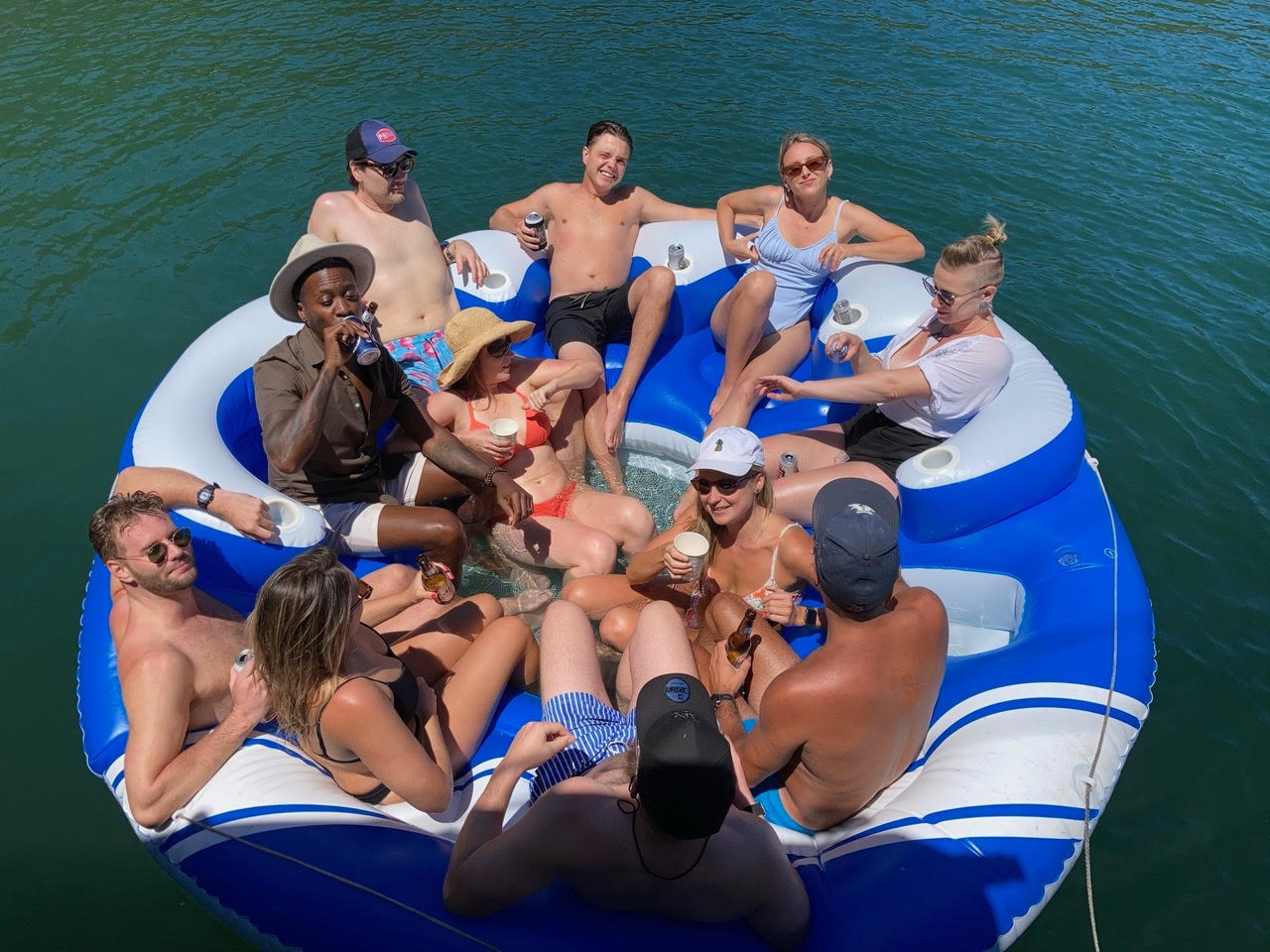 Group of people enjoying a fun gathering on a large inflatable float.