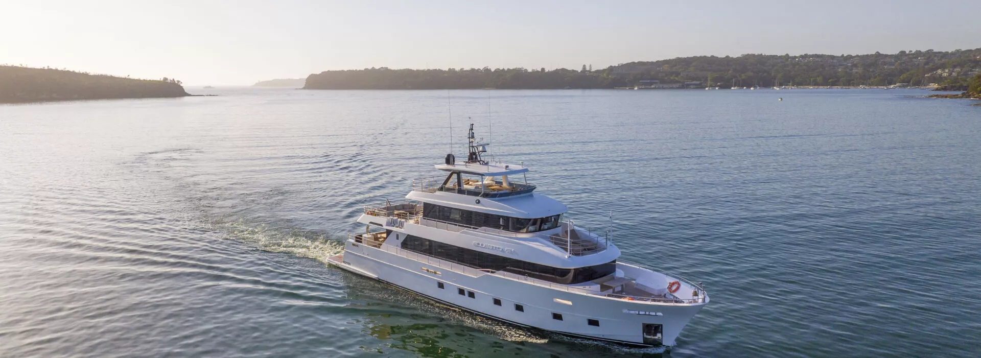 Bluestone 101ft superyacht aerial view cruising Sydney Harbour - Dreamboats