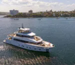 Bluestone superyacht interior salon with modern furnishings and harbour views